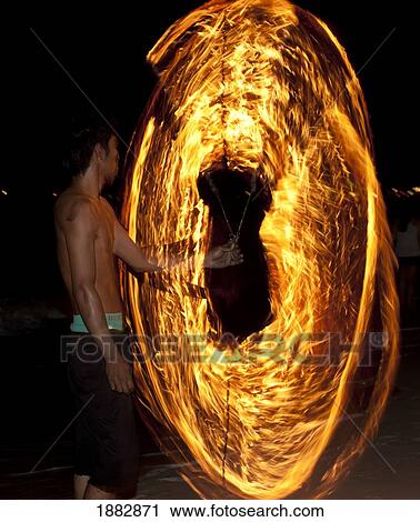 Stock Image - Man Dances With Fire; Samui Island, Koh Samui, Thailand. Fotosearch