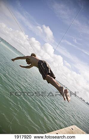 Man Diving Into Ocean View Large Photo Image Stock Image - Man Diving Into Ocean. Fotosearch