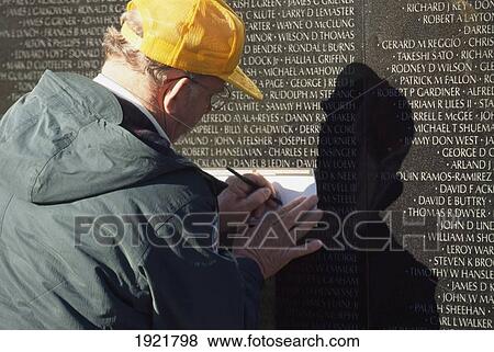 Man Doing A Rub Vietnam War Memorial View Large Photo Image Stock Photo - Man Doing A Rub Vietnam War Memorial. Fotosearch
