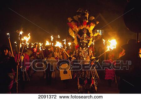 Stock Image - Man Dressed As Zulu Warrior In Procession At Barcombe Bonfire Night, Barcombe, East Sussex, Uk. Fotosearch