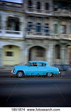 Man Driving A Blue Car Down A City Street View Large Photo Image Picture - Man Driving A Blue Car Down A City Street. Fotosearch