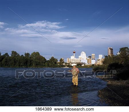 Stock Photo - Man Fishing In The River. Fotosearch