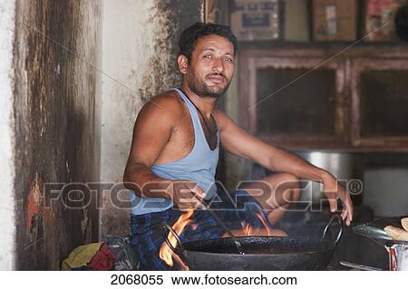 Stock Photography - Man Frying Food, Bodhgaya, Bihar, India. Fotosearch