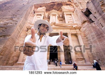 Man Giving Thumbs Up Standing By Al Khazneh In Petra View Large Photo Image Stock Image - Man Giving Thumbs Up Standing By Al Khazneh In Petra. Fotosearch