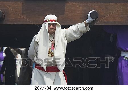 Man Guiding The Anda (Float) Of Jesus Carrying The Cross During The Procession Of The Holy Cross On Good Friday In Antigua Guatemala, Sacatep View Large Photo Image Picture - Man Guiding The Anda (Float) Of Jesus Carrying The Cross During The Procession Of The Holy Cross On Good Friday In Antigua Guatemala, Sacatep. Fotosearch