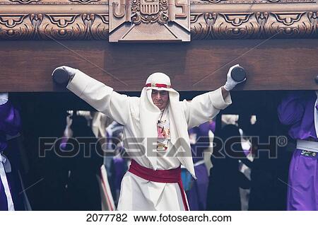 Man Guiding The Anda (Float) Of Jesus Carrying The Cross During The Procession Of The Holy Cross On Good Friday In Antigua Guatemala, Sacatep View Large Photo Image Stock Image - Man Guiding The Anda (Float) Of Jesus Carrying The Cross During The Procession Of The Holy Cross On Good Friday In Antigua Guatemala, Sacatep. Fotosearch