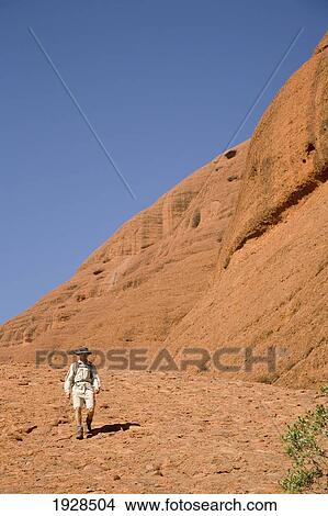 Man Hiking At The Olgas, Kata Tjuta, Northern Territory, Australia View Large Photo Image Picture - Man Hiking At The Olgas, Kata Tjuta, Northern Territory, Australia. Fotosearch