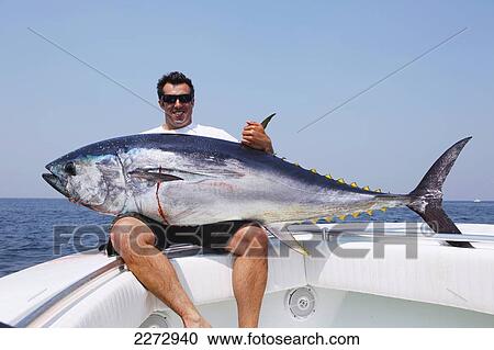 Man holding a bluefin tuna; massachusetts usa View Large Photo Image Stock Image - Man holding a bluefin tuna; massachusetts usa. Fotosearch