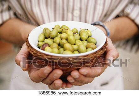 Man Holding A Bowl Of Green Olives View Large Photo Image Stock Photograph - Man Holding A Bowl Of Green Olives. Fotosearch