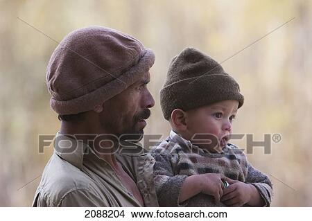Man Holding A Small Boy, Shigar, Northern Areas, Pakistan View Large Photo Image Picture - Man Holding A Small Boy, Shigar, Northern Areas, Pakistan. Fotosearch
