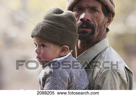 Man Holding A Small Boy, Shigar, Northern Areas, Pakistan View Large Photo Image Stock Photography - Man Holding A Small Boy, Shigar, Northern Areas, Pakistan. Fotosearch