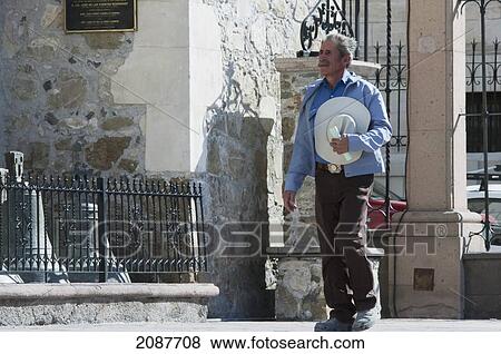 Man Holding His Hat By The Cathedral Of Saltillo, Coahuila, Mexico View Large Photo Image Stock Photo - Man Holding His Hat By The Cathedral Of Saltillo, Coahuila, Mexico. Fotosearch