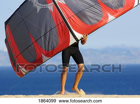 Stock Photo - Man Holding Kite For Surfing; Costa De La Luz, Andalusia, Spain. Fotosearch