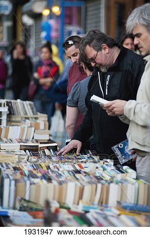 Stock Photo - Man In A Book Market In Williamsburg, Brooklyn, New York, Usa. Fotosearch