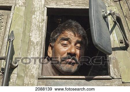 Man In A Truck, Chinari, Azad Kashmir, Pakistan View Large Photo Image Stock Photo - Man In A Truck, Chinari, Azad Kashmir, Pakistan. Fotosearch