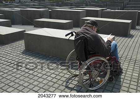 Man In A Wheelchair At The Memorial To The Murdered Jews Of Europe, Berlin, Germany View Large Photo Image Stock Photo - Man In A Wheelchair At The Memorial To The Murdered Jews Of Europe, Berlin, Germany. Fotosearch