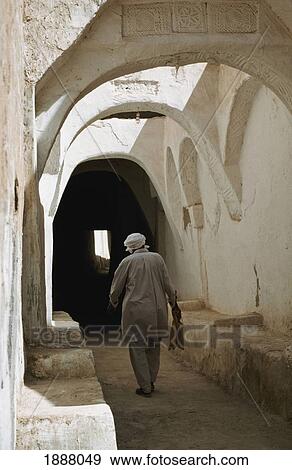Man In Alleyway In Old Town Ghadames View Large Photo Image Stock Photo - Man In Alleyway In Old Town Ghadames. Fotosearch