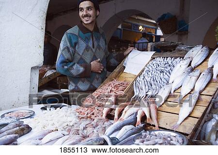 Stock Image - Man In Fish Market, Essaouira, Morocco. Fotosearch