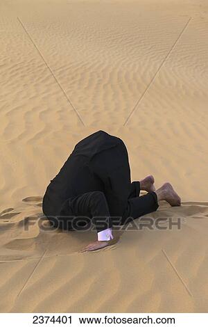 Man in smart suit with head buried in the sand; Dubai, United Arab Emirates View Large Photo Image Stock Image - Man in smart suit with head buried in the sand; Dubai, United Arab Emirates. Fotosearch