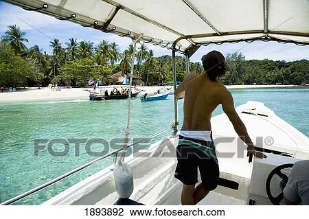 Man In Speedboat Approaching Kapas Island View Large Photo Image Stock Image - Man In Speedboat Approaching Kapas Island. Fotosearch