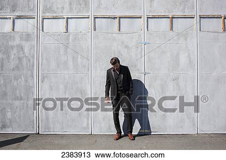 Man in suit in front of airplane hangar; Langley, British Columbia, Canada View Large Photo Image Stock Image - Man in suit in front of airplane hangar; Langley, British Columbia, Canada. Fotosearch