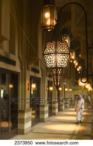 Man in traditional arabic dishdasha outfit walking along corridor in shopping mall; Dubai, United Arab Emirates View Large Photo Image Stock Image - Man in traditional arabic dishdasha outfit walking along corridor in shopping mall; Dubai, United Arab Emirates. Fotosearch
