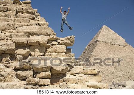 Man Jumping On Part Of A Pyramid In The Desert View Large Photo Image Picture - Man Jumping On Part Of A Pyramid In The Desert. Fotosearch
