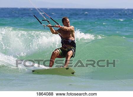 Stock Photo - Man Kite Surfing; Costa De La Luz, Andalusia, Spain. Fotosearch