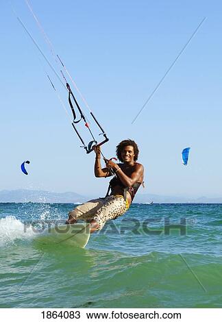 Man Kitesurfing; Costa De La Luz, Andalusia, Spain View Large Photo Image Stock Image - Man Kitesurfing; Costa De La Luz, Andalusia, Spain. Fotosearch