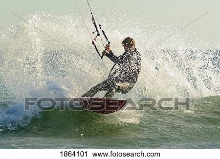 Stock Image - Man Kitesurfing; Costa De La Luz, Andalusia, Spain. Fotosearch