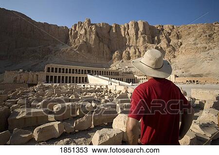 Stock Image - Man Looking At The Temple Of Hatshepsut; Luxor, Egypt. Fotosearch