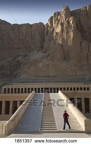 Stock Photo - Man Looking At The Temple Of Hatshepsut; Luxor, Egypt. Fotosearch
