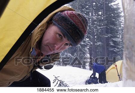 Man Looking In Tent While Camping In A Snow Storm View Large Photo Image Stock Photography - Man Looking In Tent While Camping In A Snow Storm. Fotosearch