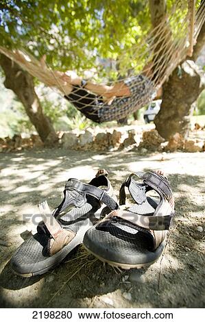 Stock Image - Man Lying In Hammock In Sunlight, Turkey.. Fotosearch