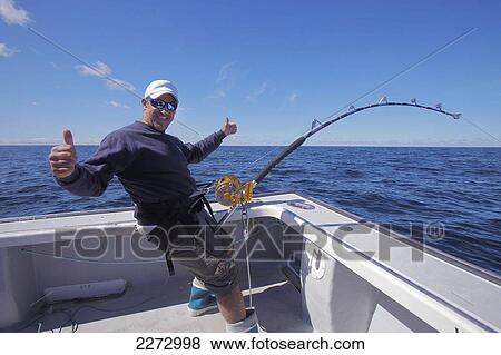 Man on a boat fishing in the atlantic ocean; prince edward island canada View Large Photo Image Stock Photo - Man on a boat fishing in the atlantic ocean; prince edward island canada. Fotosearch