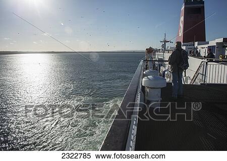 Stock Photography - Man on board of Ferry boat; County Wexford, Ireland, UK. Fotosearch