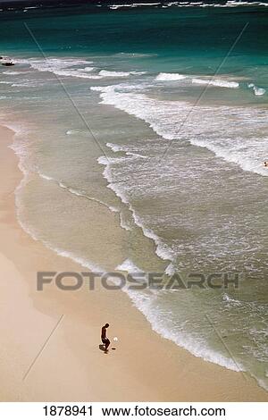 Stock Image - Man On Crane Beach. Fotosearch