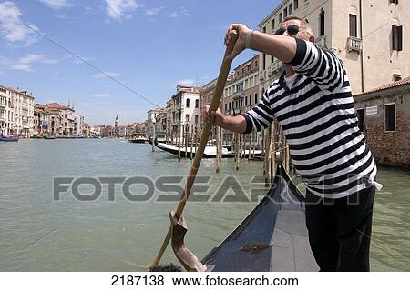 Man On Gondola, Canal, Venice, Italy. View Large Photo Image Stock Photo - Man On Gondola, Canal, Venice, Italy.. Fotosearch