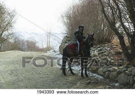 Man On Horseback In Kalu, Bamian Province, Afghanistan View Large Photo Image Stock Image - Man On Horseback In Kalu, Bamian Province, Afghanistan. Fotosearch