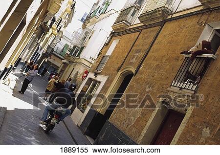 Man On Motorcycle Near People In Street View Large Photo Image Stock Photography - Man On Motorcycle Near People In Street. Fotosearch