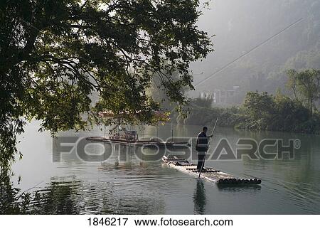 Stock Photo - Man On Raft In Mountain Area. Fotosearch