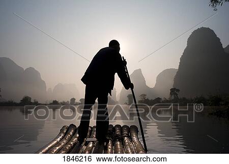 Stock Photograph - Man On Raft In Mountain Area. Fotosearch