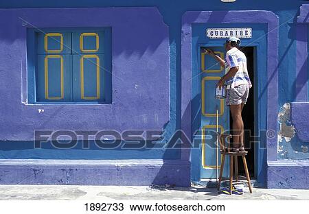 Stock Image - Man Painting House. Fotosearch