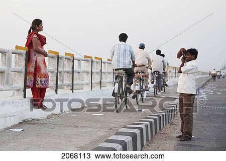 Man Photographing His Wife On The Mahatma Gandhi Seti (Bridge), Patna, Bihar, India View Large Photo Image Stock Image - Man Photographing His Wife On The Mahatma Gandhi Seti (Bridge), Patna, Bihar, India. Fotosearch