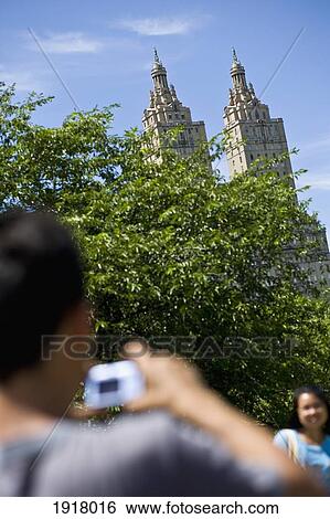 Man Photographing Woman In Central Park View Large Photo Image Stock Photograph - Man Photographing Woman In Central Park. Fotosearch