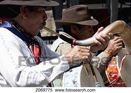 Man Playing An Erque, Whilst Drumming On A Caja In The Entrada De Comadritas Parade During The Carnaval Chapaco, Tarija, Bolivia View Large Photo Image Stock Photography - Man Playing An Erque, Whilst Drumming On A Caja In The Entrada De Comadritas Parade During The Carnaval Chapaco, Tarija, Bolivia. Fotosearch