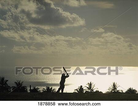 Man Playing Cricket By Coastline In Silhouette View Large Photo Image Stock Photo - Man Playing Cricket By Coastline In Silhouette. Fotosearch