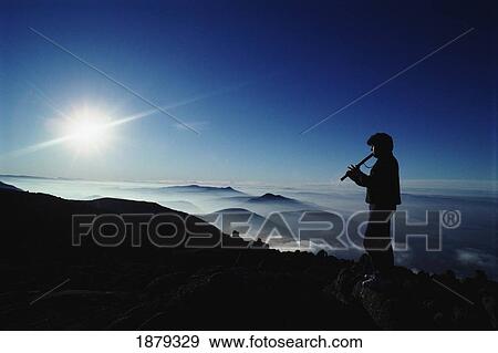 Man Playing Flute Above Mountains View Large Photo Image Stock Photo - Man Playing Flute Above Mountains. Fotosearch