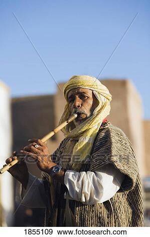 Man Playing Flute In Essaouira, Morocco View Large Photo Image Stock Photo - Man Playing Flute In Essaouira, Morocco. Fotosearch