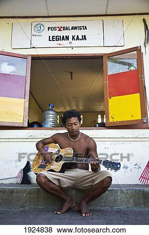Man Playing Guitar Outside Bar View Large Photo Image Stock Photo - Man Playing Guitar Outside Bar. Fotosearch
